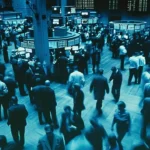 Blue market trading floor with active traders